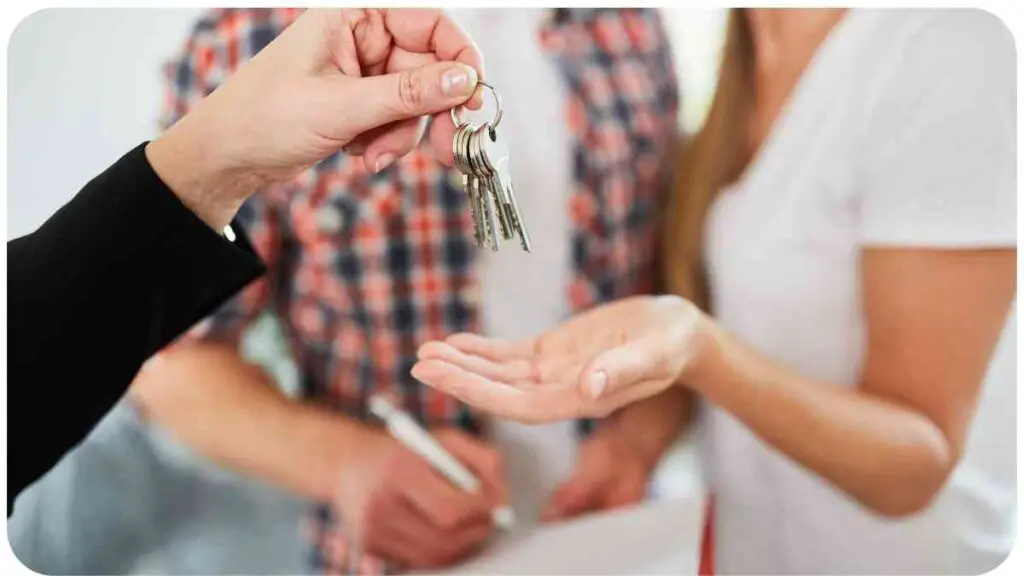 a person handing keys to another person in front of a house