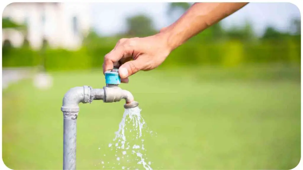 a person is filling water from a faucet