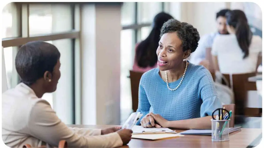 an individual sitting at a table talking to another person