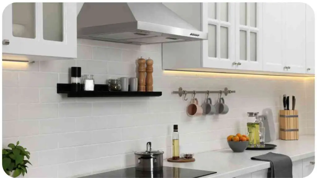 a modern kitchen with white cabinets and stainless steel appliances